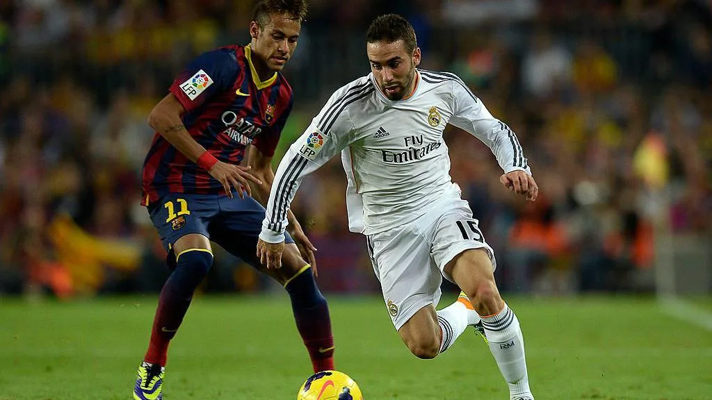 Dani Carvajal dribbles past Barcelona's Neymar during a game in October 2013