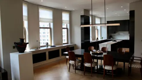 Would you pay $58.5m to live in this iconic New York building? Grace Eliza Goodwin view of open-concept kitchen and modern dining furniture in residential unit, with large windows