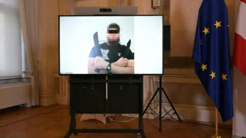 Terror trial to begin for man accused of plotting attack on Taylor Swift concert AFP via Getty Images A photo of one of three suspects - seen here holding a knife - arrested in connection with a foiled attack on Taylor Swift's concert in Vienna. Photo: 8 August 2024