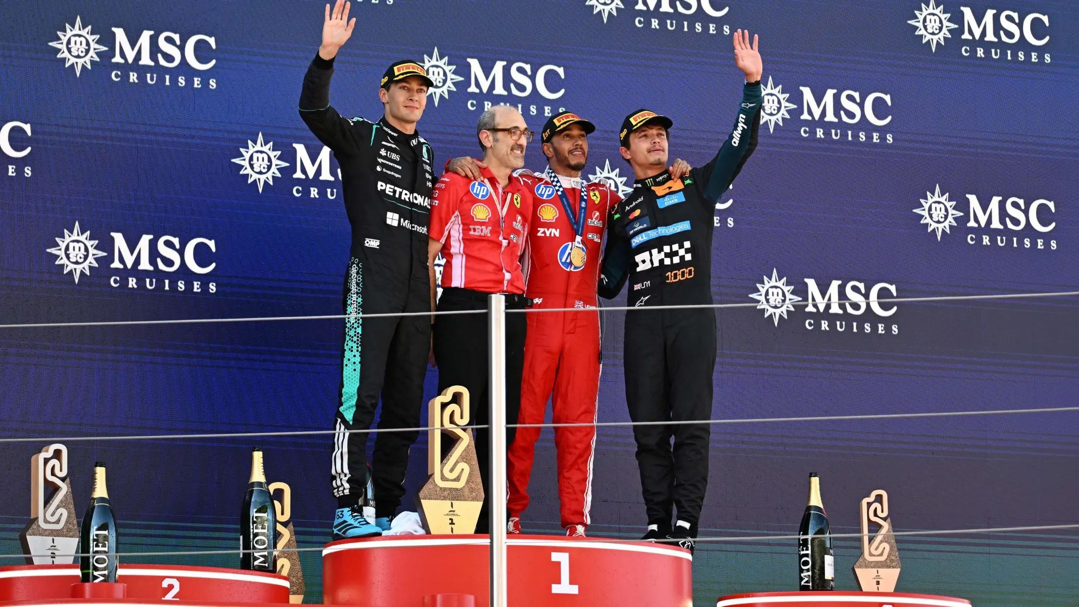 Lewis Hamilton, George Russell and Lando Norris celebrate on the podium after the Barcelona-Catalunya Grand Prix