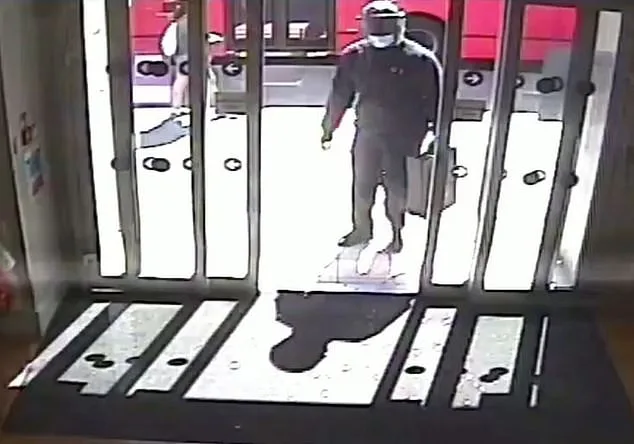 Footage played in court shows Kwabena Kissi, 40, carrying a large security briefcase and entering a Santander bank in Brixton , south London , on July 5, 2022