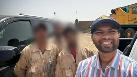 I survived a missile strike in the Strait of Hormuz, but my friend has not been found Rex Pereira Rex Pereira standing in a striped shirt with three men in beige overalls standing next to a car