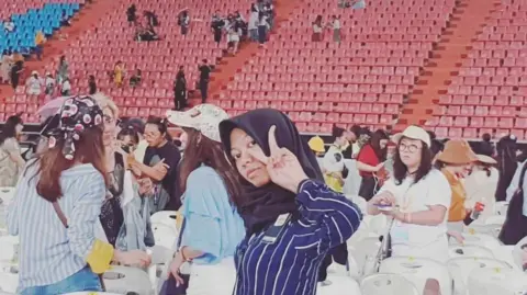 The BTS fans losing thousands as scammers cash in on comeback tour 'ticket war' Supplied Vevee at the 2019 concert in Bangkok