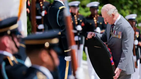 Getty Images King Charles III lays a wreath at the Tomb of the Unknown Soldier during a ceremony at Arlington National Cemetery on the final day of the state visit of King Charles III and Queen Camilla on April 30, 2026 in Arlington, Virginia.