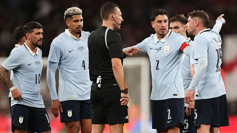 Uruguay's Federico Valverde and Jose Maria Gimenez lead the protests to referee Sven Jablonski after England's opening goal at Wembley Stadium 