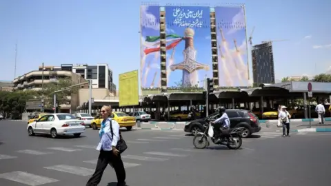 Israel carries out air strikes on Lebanon, state media says, as Iran claims deal with US near Reuters A large billboard in Tehran which people drive and walk past