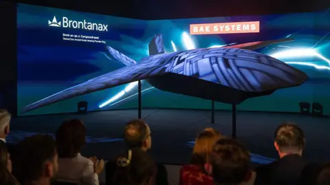 Getty Images Brontanax, a BAE Systems uncrewed Collaborative Combat Aircraft (CCA), is unveiled at Farnborough International Airshow