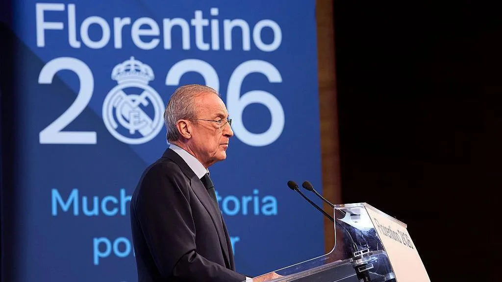 Real Madrid president Florentino Perez stands in front of a campaign poster at a lectern while giving a speech ahead of the club's 2026 presidential elections