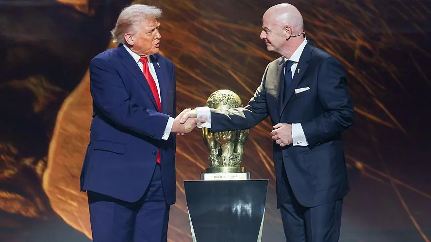 Infantino could have stood up for the World Cup - but he said 'chill, relax' FIFA president Gianni Infantino and US President Donald Trump shake hands during the World Cup's official draw