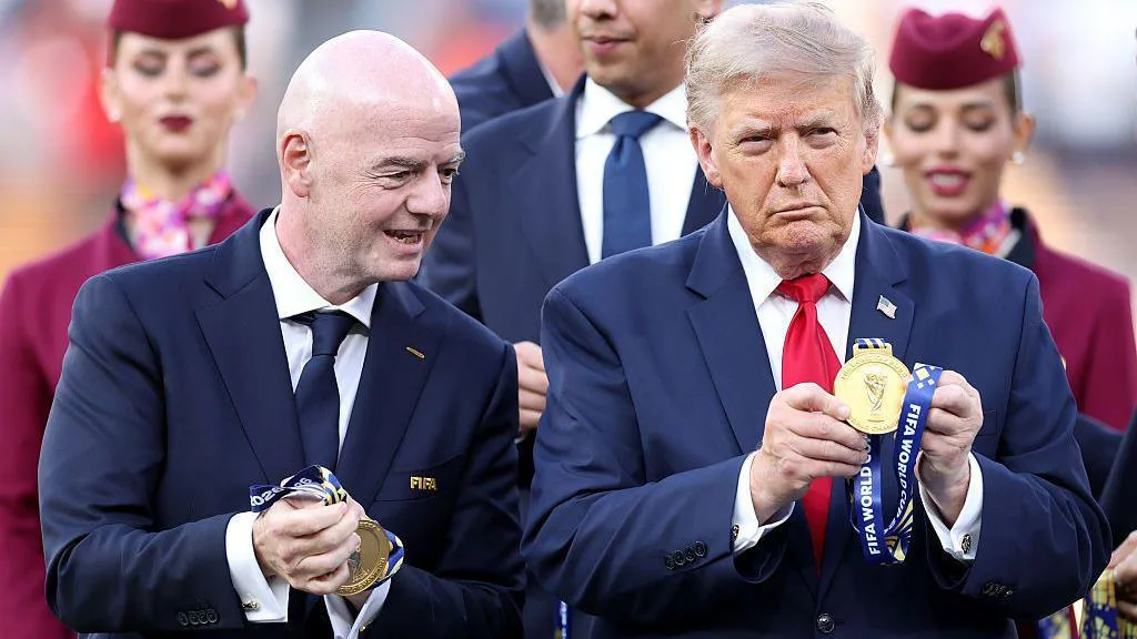 FIFA president Gianni Infantino applaud while talking and holding winners' mealds during the trophy presentation at the 2026 World Cup final between Spain and Argentina at MetLife Stadium in New York