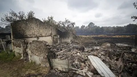 Lorena Sopena Lopez/Anadolu via Getty Image Rubble of burnt houses in the Gironde region of France.