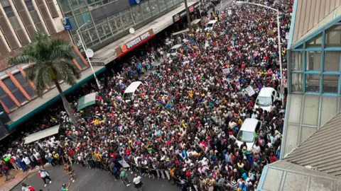 Thuthuka Zondi / BBC Aerial view of the marchers in Durban