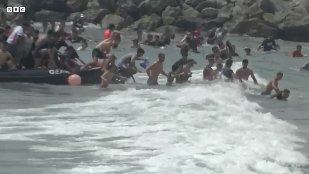 Hundreds of migrants enter Spain’s Ceuta enclave as authorities warn of humanitarian crisis Hundreds of migrants enter Spain’s Ceuta enclave as authorities warn of humanitarian crisis