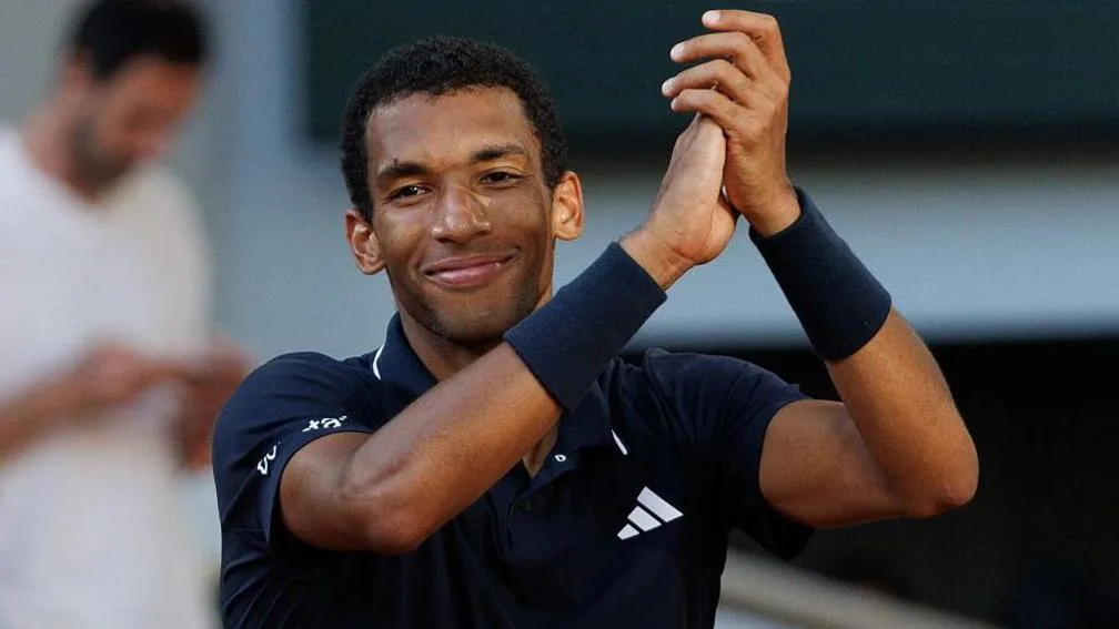 Felix Auger-Aliassime claps his hands