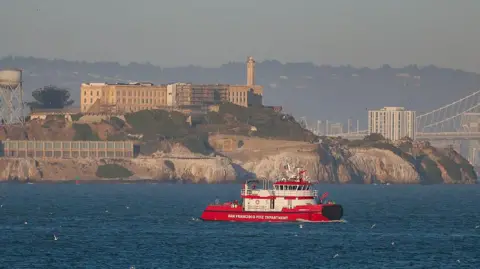 Getty Images A San Francisco Fire Department boat searches near Alcatraz Island