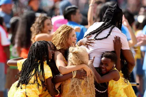 Dancing with Shakira at World Cup was 'very, very, very, very, very good' - Ghetto Kids Getty Images for Global Citizen Shakira and Burna Boy hug Ghetto Kids after their routine at the World Cup final half-time show