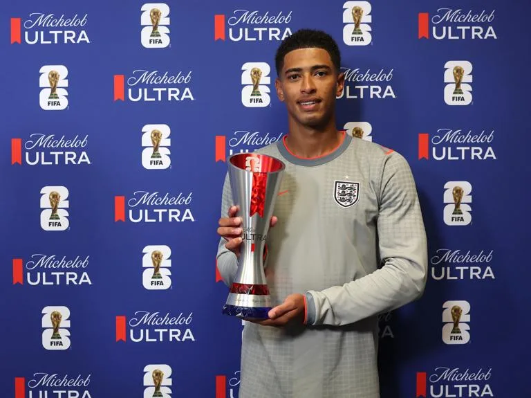 EAST RUTHERFORD, NEW JERSEY - JUNE 27: Jude Bellingham #10 of England poses with the Michelob Ultra Superior Player of the Match Trophy during the FIFA World Cup 2026 Group L match between Panama and England at New York New Jersey Stadium on June 27, 2026 in East Rutherford, New Jersey. (Photo by Maddie Meyer - FIFA/FIFA via Getty Images)