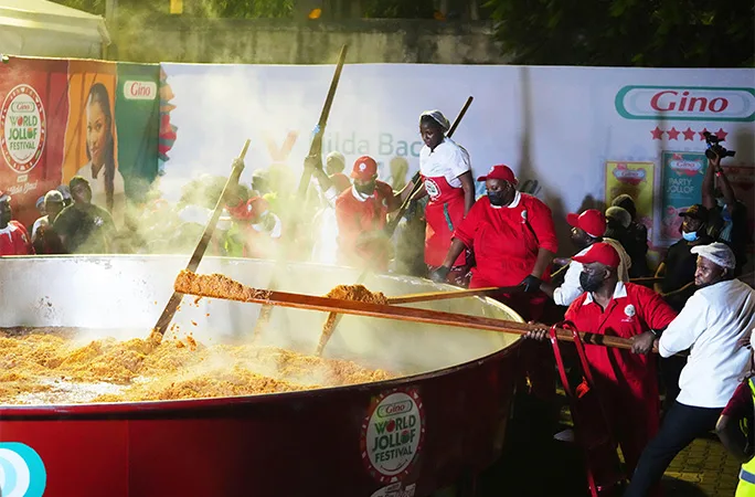 Hilda making a giant serving of jollof rice