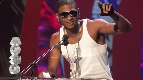 Getty Images Usher giving an acceptance speech at the 2001 ceremony