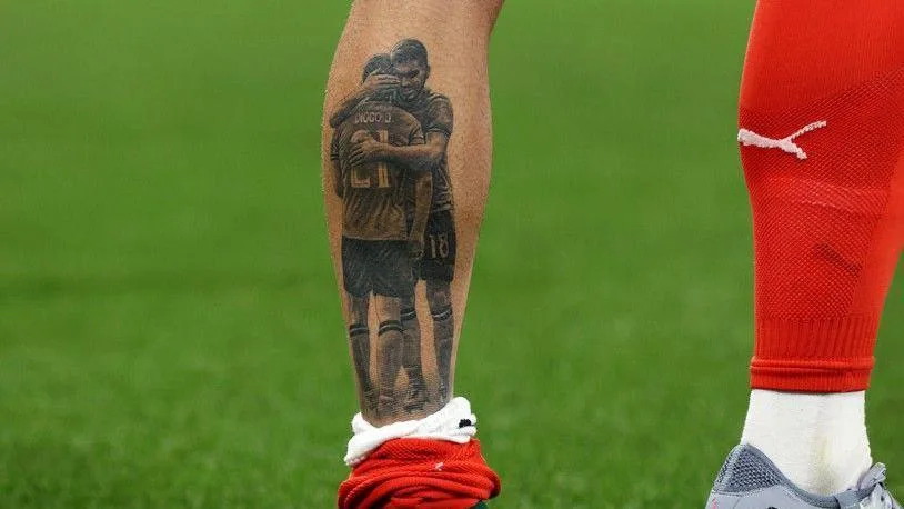 'We want to win World Cup for him' - Portugal carry Diogo Jota's memory A tattoo on the calf of footballer Ruben Neves shows him embracing his former Porto, Wolves and Portugal team-mate Diogo Jota, who died in a car accident on 3 July, 2025