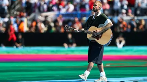 Getty Images Justin Bieber holding a guitar