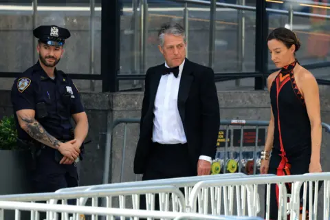 Taylor Swift and Travis Kelce wed in NYC in ceremony officiated by Adam Sandler Getty Images Actor Hugh Grant and wife Anna Elisabet Eberstein arrive at Madison Square Garden in formalwear.