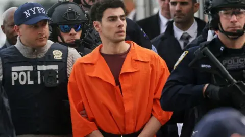 Mangione admits killing healthcare CEO and pleads guilty to federal charges Getty Images Luigi mangione after his arrest in 2024