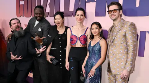 Getty Images Kaylee Hottle stands alongside her cast members Adam Wingard, Brian Tyree Henry, Fala Chen, Rebecca Hall and Dan Stevens at the premiere of Godzilla X Kong: The New Empire.