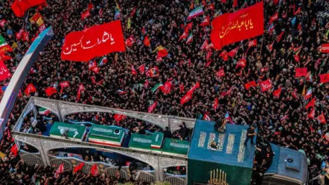 EPA red flags and big crowds at Khamenei's funeral in Mashhad