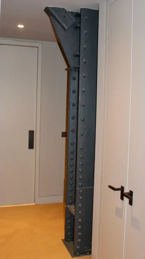 Would you pay $58.5m to live in this iconic New York building? Grace Eliza Goodwin A steel support beam exposed in a hallway
