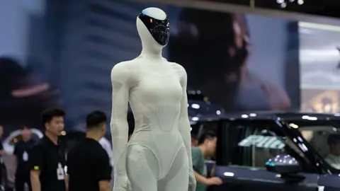 The Chinese robot army transforming the UK's retail industry Getty Images XPeng's humanoid robot IRON is on display