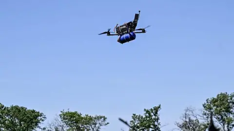 Russia looks to students to make up for mounting losses in Ukraine Ukrinform/NurPhoto via Getty Images A remotely controlled FPV drone, equipped with ammunition, is seen in the sky during a combat mission of a Ukrainian drone unit in 2025