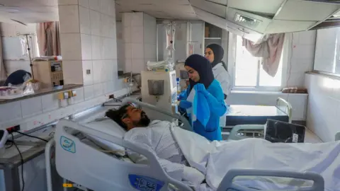 Reuters Medics treat a patient on a ward at Jabal Amel hospital in the city of Tyre, southern Lebanon, following Israeli air strikes on nearby buildings (2 June 2026)