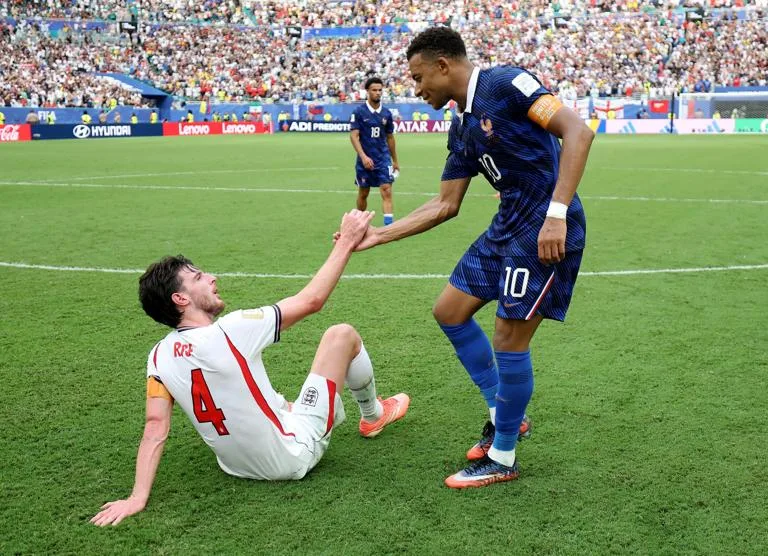 MIAMI GARDENS, FLORIDA - JULY 18: Kylian Mbappe #10 of France shakes hands with Declan Rice #4 of England after the 4-6 loss during the FIFA World Cup 2026 Bronze Final between France and England at Miami Stadium on July 18, 2026 in Miami Gardens, Florida. (Photo by Sarah Stier - FIFA/FIFA via Getty Images)