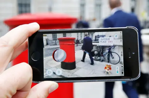 10 years of Pokémon Go and the millions still trying to catch 'em all Getty Images A phone held horizontal with the Pokémon Go game running over a UK address of Suffolk place. A Spearow sits in the corner on the phone.