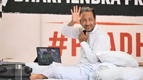 Getty Images NEW DELHI, INDIA - JULY 5: Sonam Wangchuk, Climate activist seen sitting on hunger strike at Jantar Mantar, on July 6, 2026 in New Delhi, India. (Photo by Sanchit Khanna/Hindustan Times via Getty Images)