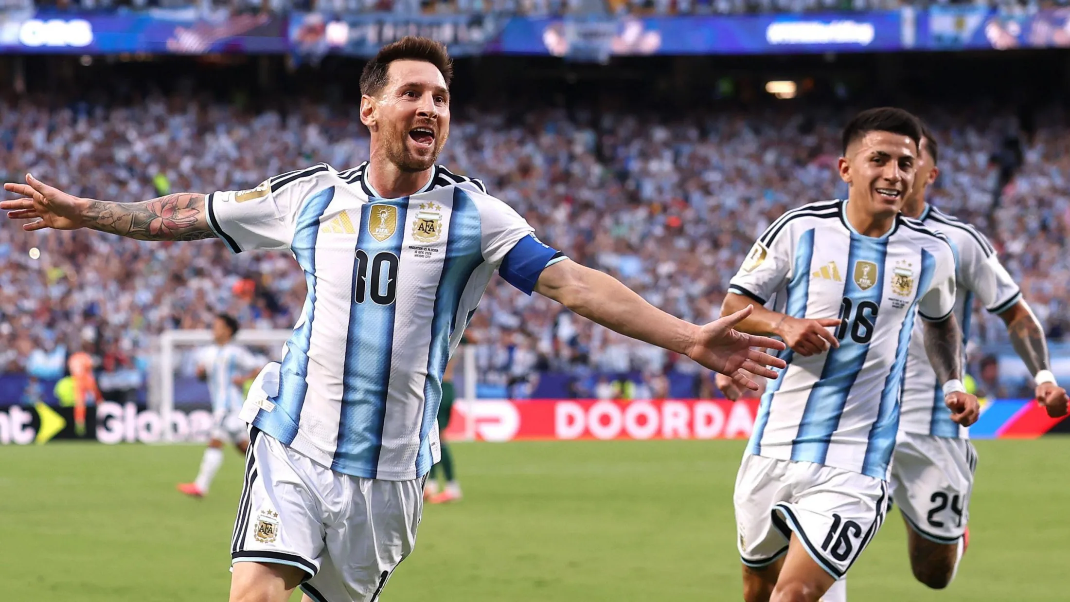 Lionel Messi celebrates scoring the first goal during Argentina's 3-0 win over Algeria