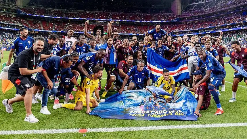 The Cape Verde squad pictured together on the pitch in front of a flag