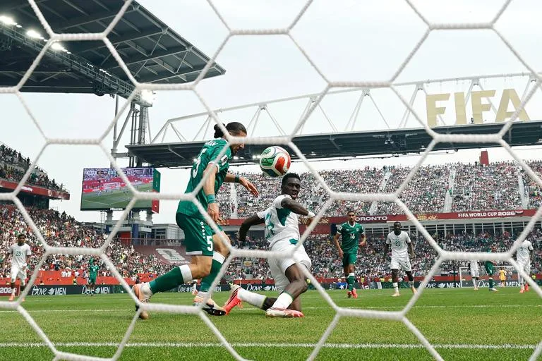 TORONTO, ONTARIO - JUNE 26: (EDITOR'S NOTE: Image was captured using a remote camera from behind the goal.) Ismaila Sarr #18 of Senegal scores his team's second goal during the FIFA World Cup 2026 Group I match between Senegal and Iraq at Toronto Stadium on June 26, 2026 in Toronto, Ontario. (Photo by Michael Reaves/Getty Images)