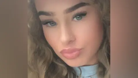 TikTok influencer charged with Dubai murder Detained in Dubai A close-up selfie of a young woman with dark blonde wavy hair, posing for the camera