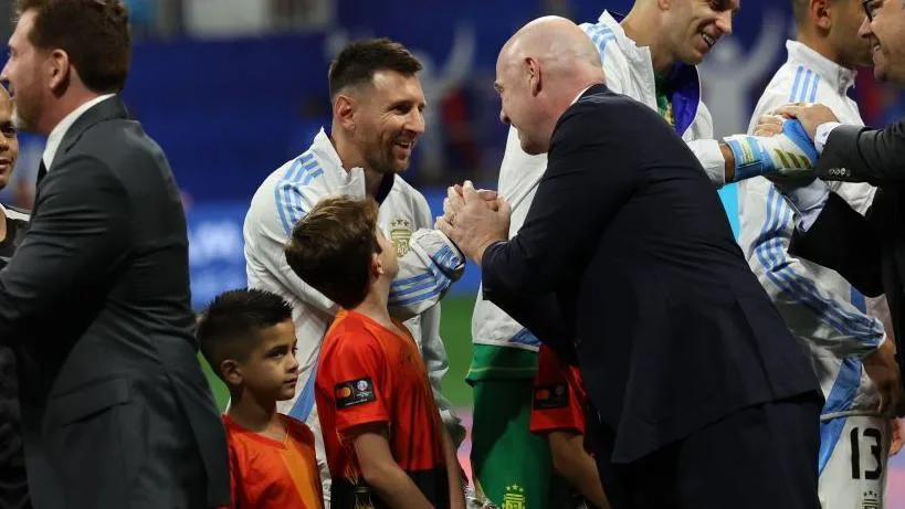 Lionel Messi shakes hands with Gianni Infantino, the president of Fifa, before the Copa America group A match between Canada and Argentina
