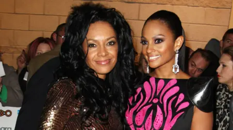 Getty Images Kanya King and Alesha Dixon standing and smiling together 