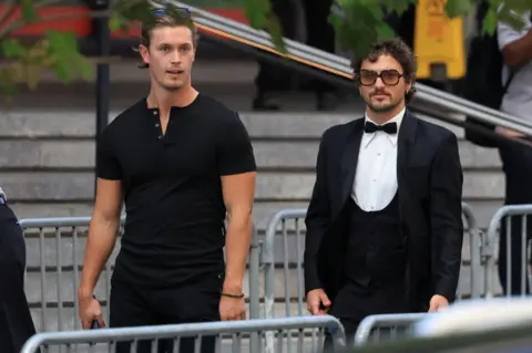 Taylor Swift and Travis Kelce wed in NYC in ceremony officiated by Adam Sandler Getty Images US singer Benson Boone, right, arrives at Madison Square Garden
