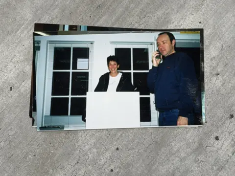 'He liked the fear in our eyes', Epstein survivors tell BBC Chauntae Davies A woman, Ghislane Maxwell, with a short haircut smiles and stands behind a white podium to her left a man, Kevin Spacey, has a cell phone on his right ear. He is wearing a navy shirt and blue jeans.