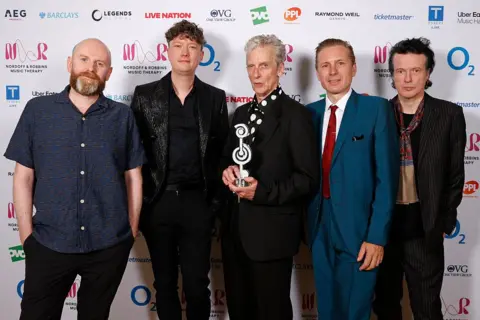 Getty Images Peter Capaldi and Franz Ferdinand