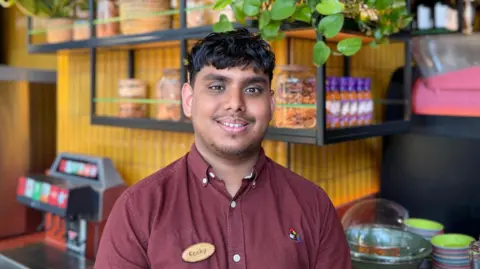 Young people out of work or training costing UK £125bn as report warns of 'perfect storm' Spear Rocky in his Nandos uniform
