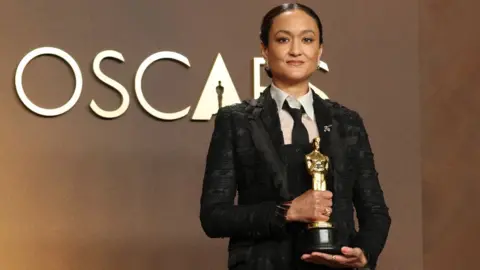 Getty Images Autumn Durald Arkapaw, winner of the Best Cinematography Award for “Sinners”, poses in the press room during the 98th Oscars at Dolby Theatre on March 15, 2026 in Hollywood, California.