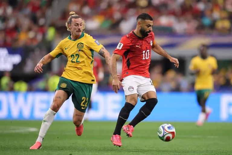 ARLINGTON, TEXAS - JULY 03: Mohamed Salah #10 of Egypt controls the ball against Jackson Irvine #22 of Australia during the FIFA World Cup 2026 Round of 32 match between Australia and Egypt at Dallas Stadium on July 03, 2026 in Arlington, Texas. (Photo by Hector Vivas - FIFA/FIFA via Getty Images)