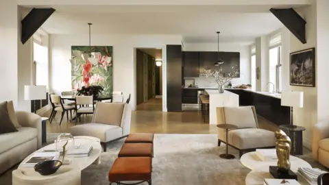 Would you pay $58.5m to live in this iconic New York building? Adrian Gaut Open-concept apartment living room with modern furniture and kitchen