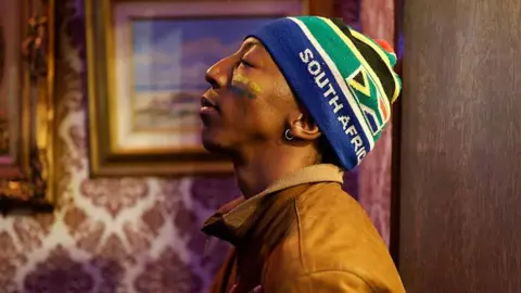 AFP via Getty Images A South African football supporter reacts during the opening football match of the 2026 FIFA World Cup, at Kitcheners in Braamfontein, in Johannesburg
